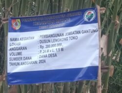 Papan Nama Proyek Jembatan Gantung Senilai Rp200 Juta di Mrawan Jember Telah Terpasang